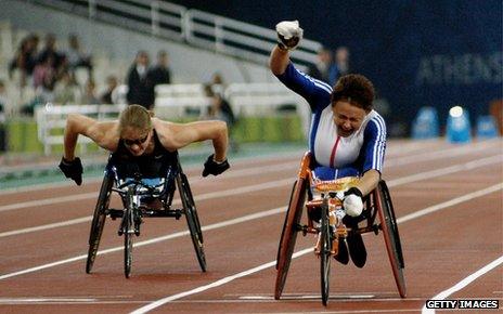 Tanni Grey-Thompson (right) crosses finishing line at Athens Paralympics, 2004