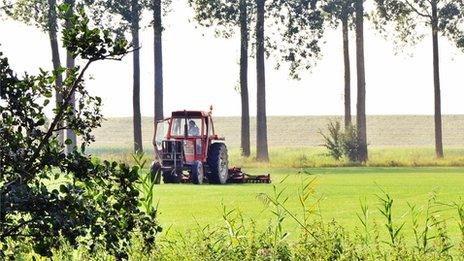 A tractor tending land in Zeeland province, south-western Netherlands