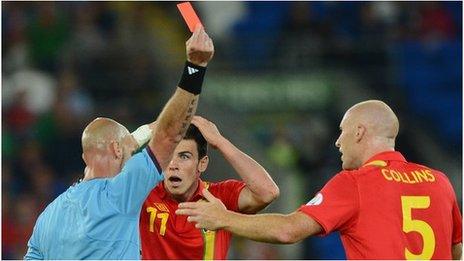 James Collins receives a red card against Belgium