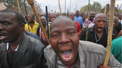 Workers marching in Marikana in South Africa's North West province on 5 September 2012