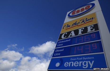 Motorway services sign - showing petrol prices and advertising cafe