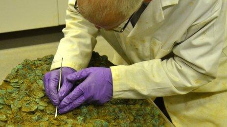 Neil Mahrer working on the coin hoard