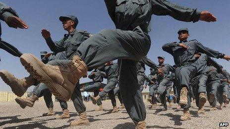 Afghan National Police (ANP) personnel march during a graduation ceremony in Herat