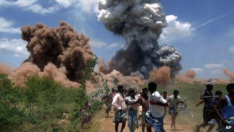 People run away from the fire in the factory in Sivakasi on September 5