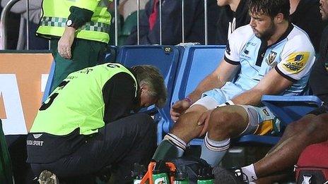 Ben Foden receives treatment after suffering an ankle injury