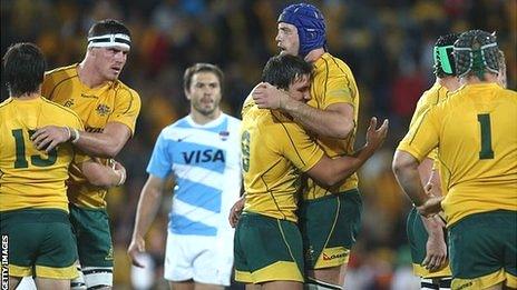 Australia's Nathan Sharpe and Nick Phipps celebrate