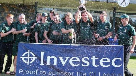 Argyll Investment celebrate winning the title