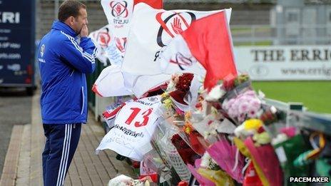 Mourner at tribute site