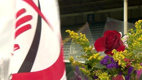 Ulster rugby flag and flowers