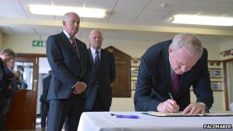 Martin McGuinness signs condolence book