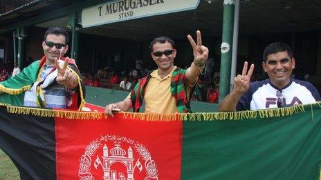 Cricket fans Zia Aryoobi (L) and Ishan Hashimi and Islamuddin Aryoobi