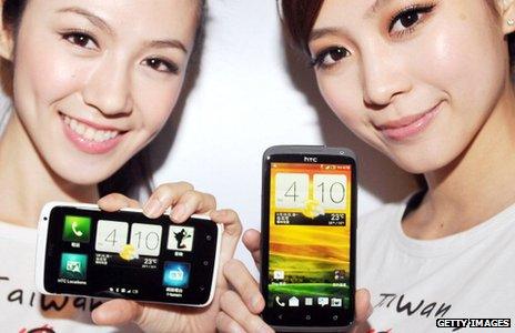 Models hold the HTC One X phones