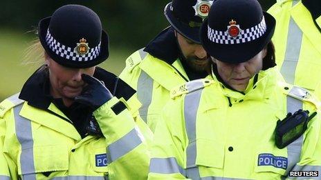 Police officers earlier gathered at the scene of the attacks in Mottram, Tameside