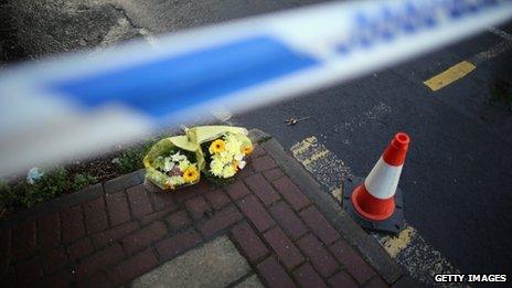 Flowers left at the scene where to police officers were killed in Greater Manchester