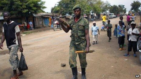 An M23 rebel walks the streets of the North Kivu town of Rubare near Rutshuru, 75km (48 miles) north of Goma, DR Congo