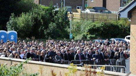 Crowds of mourners outside service