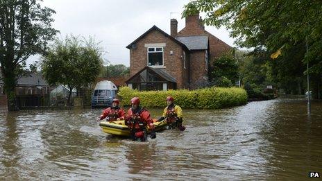 Northumberland fire and rescue search flooded houses in Morpeth