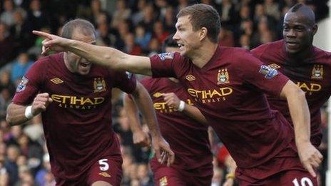 Edin Dzeko celebrates after scoring Manchester City's winner