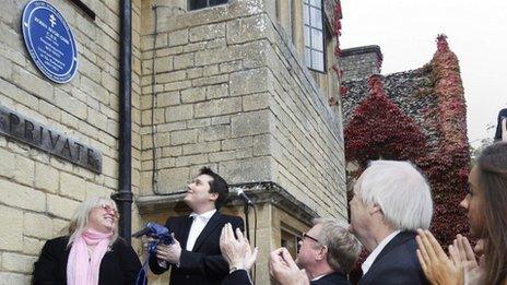 A blue plaque to honour Robin Gibb is unveiled by his widow Dwina (left) and son Robin-John (right), at their home in Thame