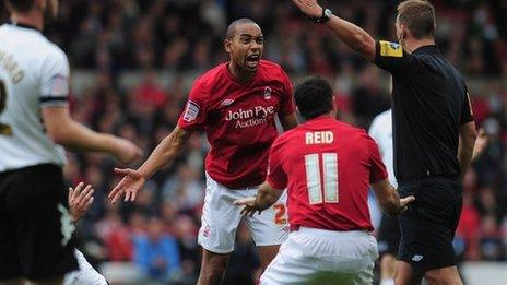 Dexter Blackstock pleads his innocence to referee Robert Madley