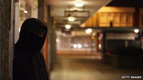 Teenager in a hoodie in a Bristol shopping centre