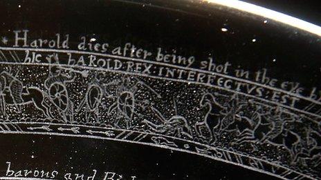 A glass dish engraved with the Bayeux Tapestry