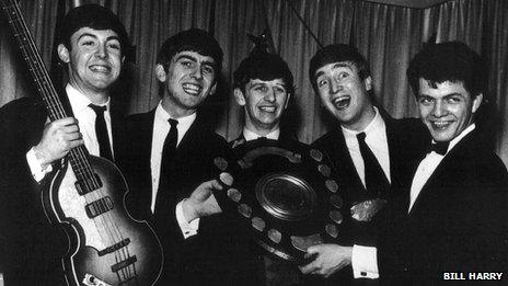 The Beatles with Bill Harry (right)