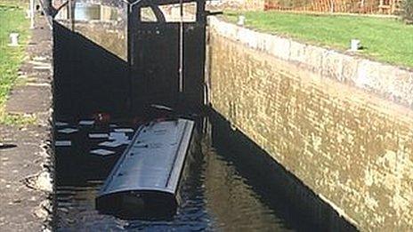 Sunken narrow boat in Caen Hill locks in Wiltshire