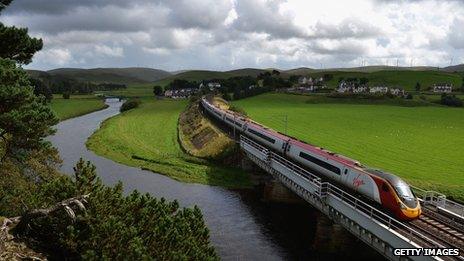 A Virgin train passes along the West Coast Main Line route near Abington on 29 August