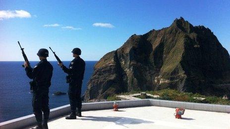 Armed South Korean policemen stand on guard on the disputed Dokdo/Takeshima islands, 04 Oct 2012