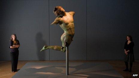 Bronze statue entitled "dancing satyr"