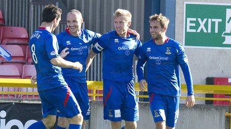 Richie Foran is congratulated by his Inverness team-mates