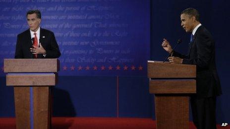 Republican presidential nominee Mitt Romney and President Barack Obama speak during the first presidential debate at the University of Denver Oct 3 2012