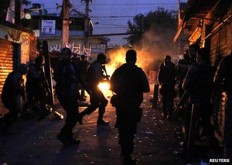 Brazilian police take up position in the Jacarezinho slum in Rio de Janeiro, 14 October