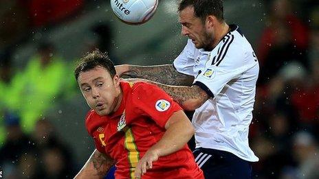 Darcy Blake in action against Scotland's Steven Fletcher