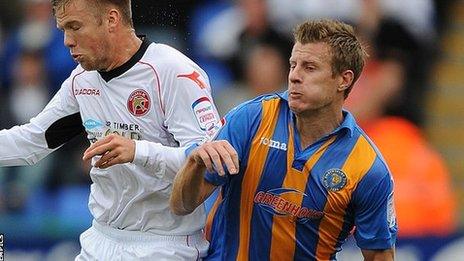 Walsall's Nicky Featherstone and Shrewsbury Town"s Paul Parry