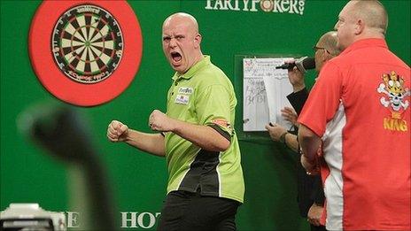 Michael van Gerwen celebrates winning a leg against Mervyn King