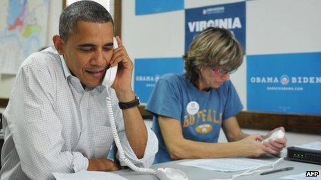 Barack Obama makes phone calls with volunteers in Williamsburg, Virginia 14 October 2012