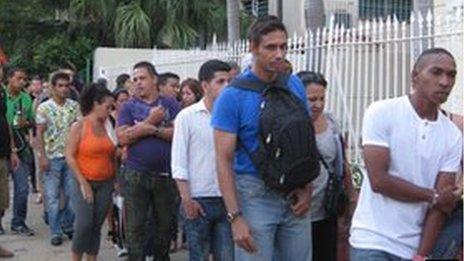 People queuing at an emigration office in Havana