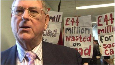 Councillor Peter Jones in front of protesters