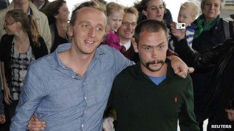 Swedish reporter Martin Schibbye and photographer Johan Persson (R) arrive at Arlanda airport in Stockholm September 14, 2012.