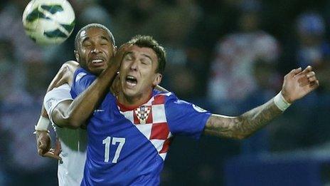 Wales' Ashley Williams challenges Croatia goal-scorer Mario Mandzukic