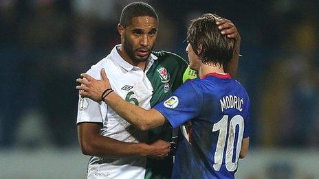 Wales captain Ashley Williams (left) is consoled by Croatia's Luka Modric