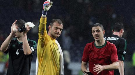 Northern Ireland players celebrate after the final whistle in Porto