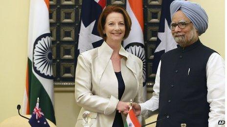 Australian Prime Minister Julia Gillard, left, shakes hands with Indian Prime Minister Manmohan Singh after a meeting in New Delhi, India, Wednesday, Oct. 17, 2012. (