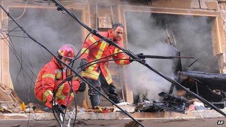 Rescue workers remove rubble from building damaged in Beirut blast (19 October)