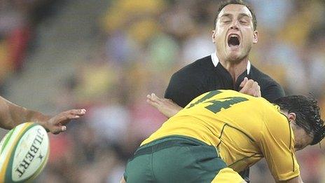 All Blacks full-back Israel Dagg loses the ball as he is tackled by Australia's Adam Ashley-Cooper