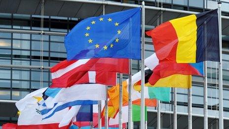 European Union flag fly amongst European Union member countries" national flags in front of the European Parliament