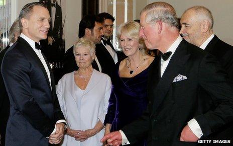 Prince Charles and the Duchess of Cornwall meet Daniel Craig (l) and Dame Judi Dench