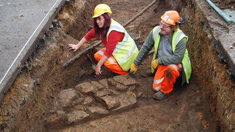 Archaeologists in a trench at Northampton Station